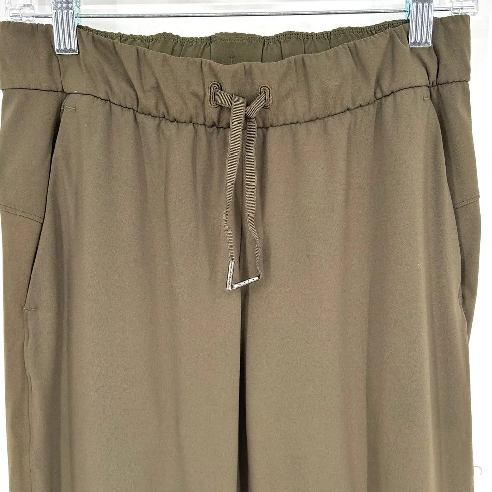 Lululemon‎ On The Fly Jogger 7/8 Mid Rise Olive Green Stretch Drawstring Size 6